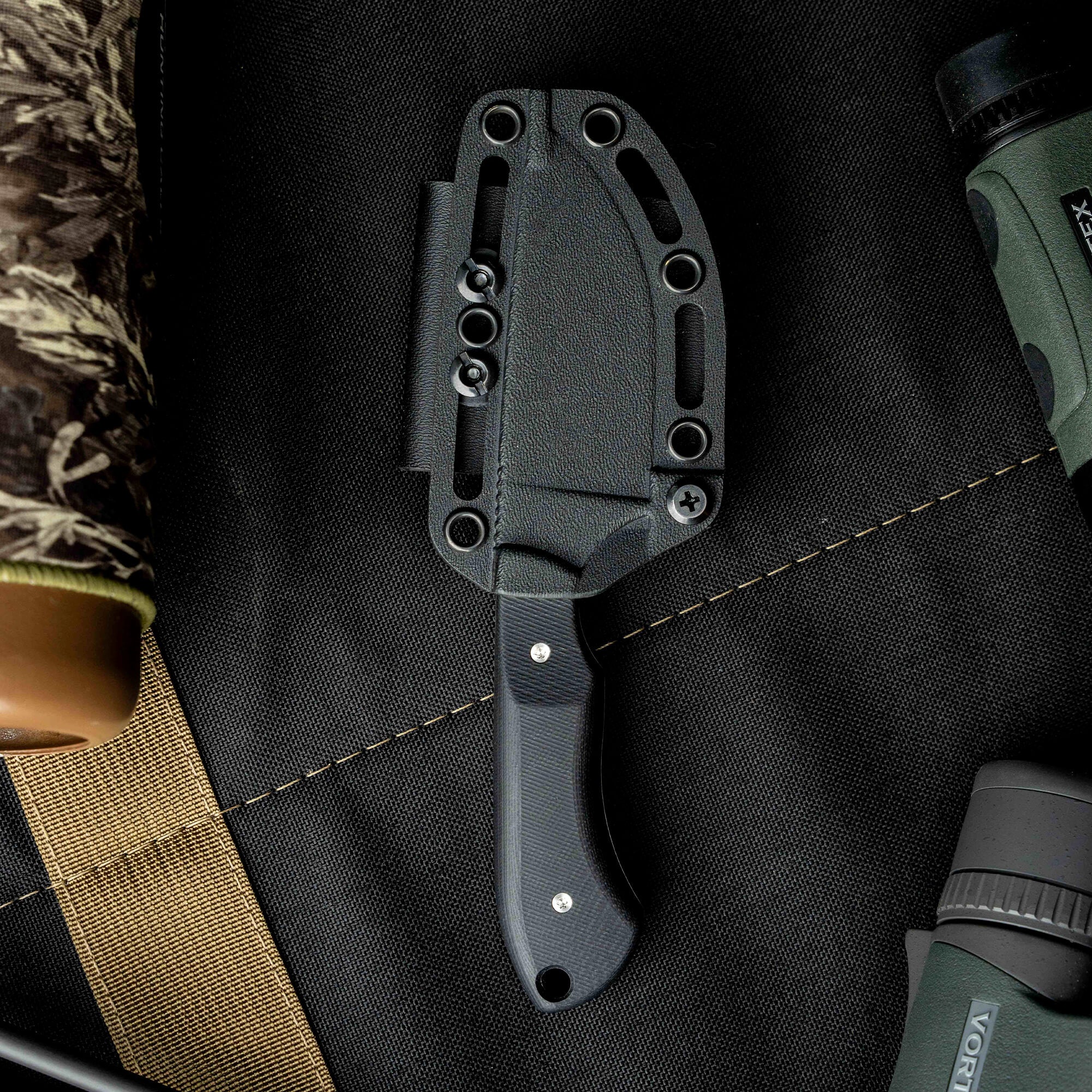 Montana Knife Company's sold-out Live Wild Elk Knife featuring a sleek design and durable sheath, ideal for outdoor enthusiasts.