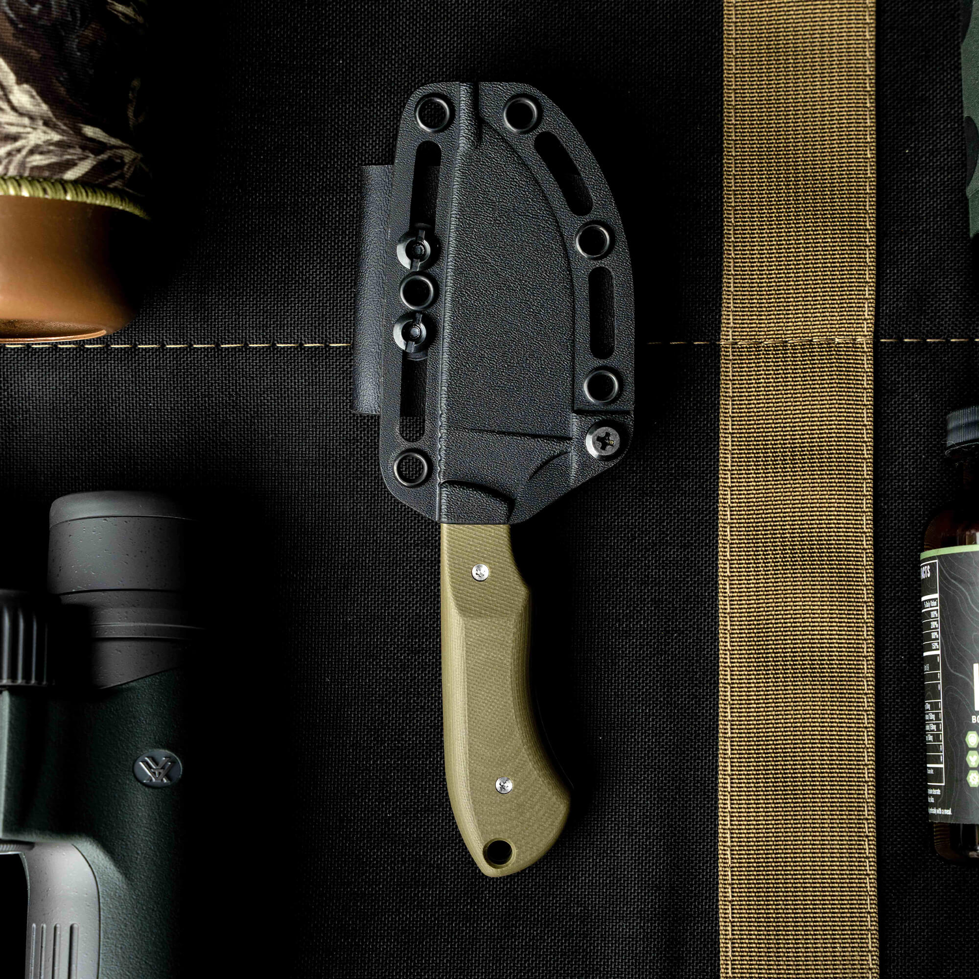 SOLD OUT MKC Elk Knife with a green handle and black sheath, designed for outdoor enthusiasts and hunters.