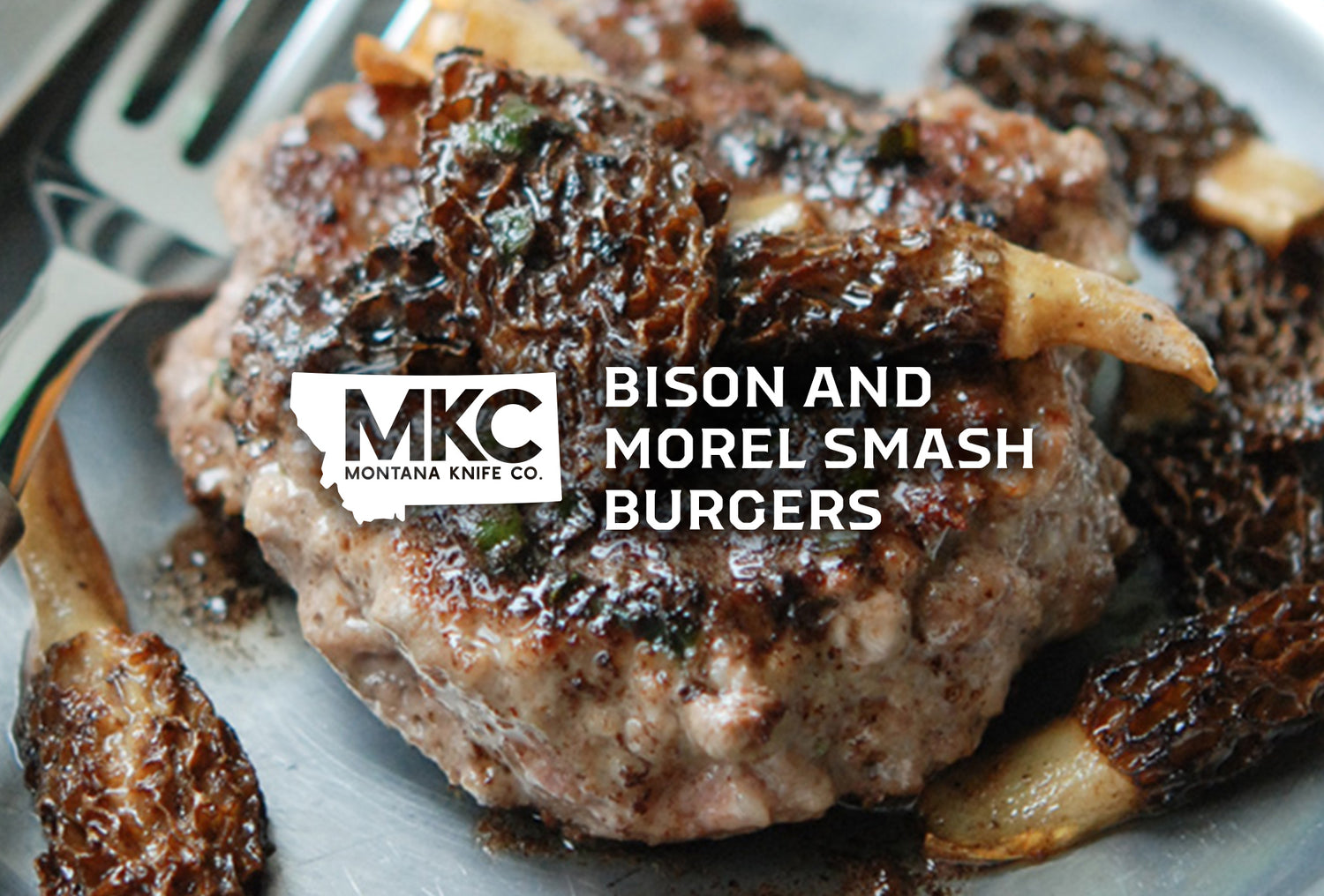 A close-up shot of a pile of juicy bison smash burgers, smothered in mushrooms.