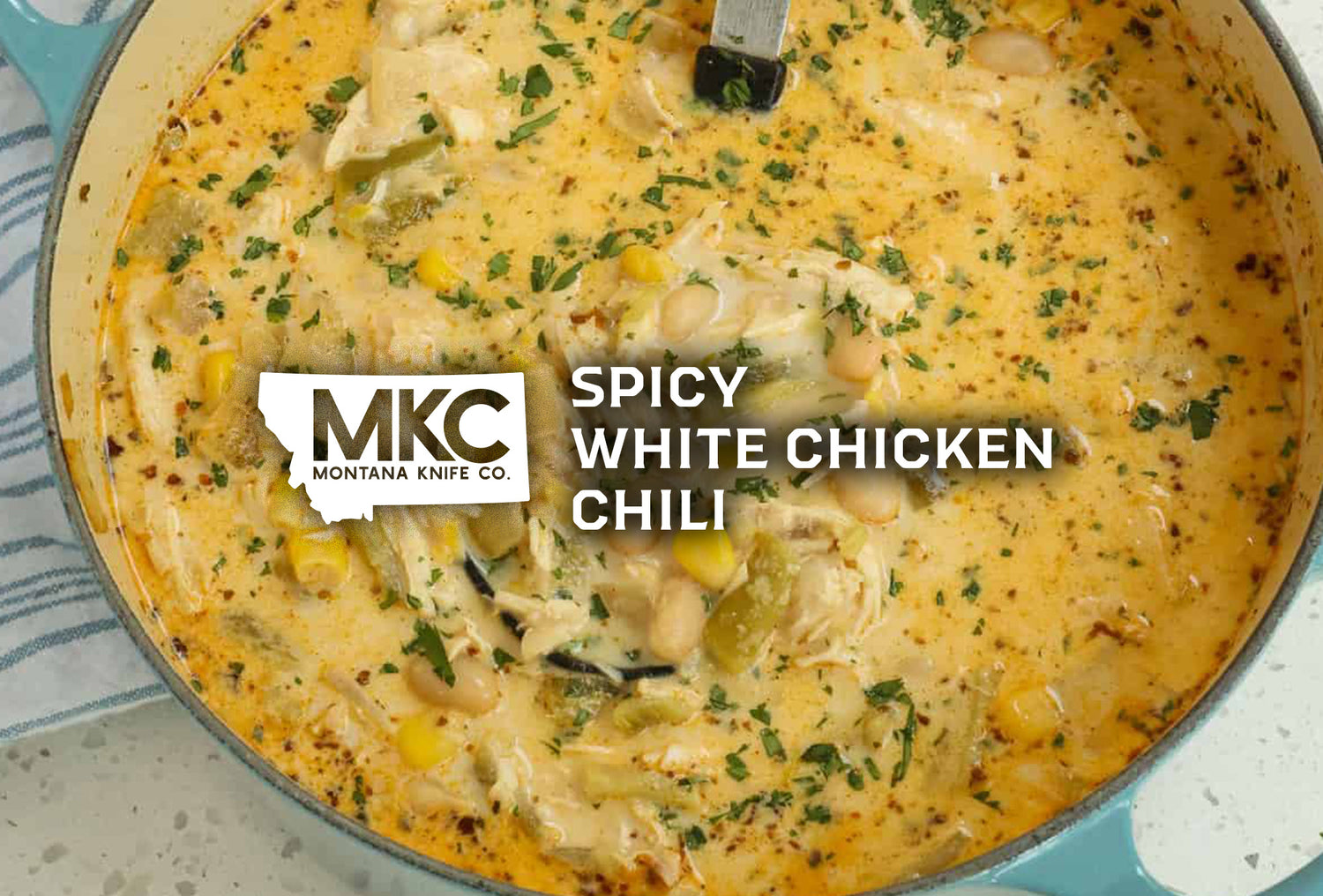 A light blue dutch oven full of delicious white chicken chili.