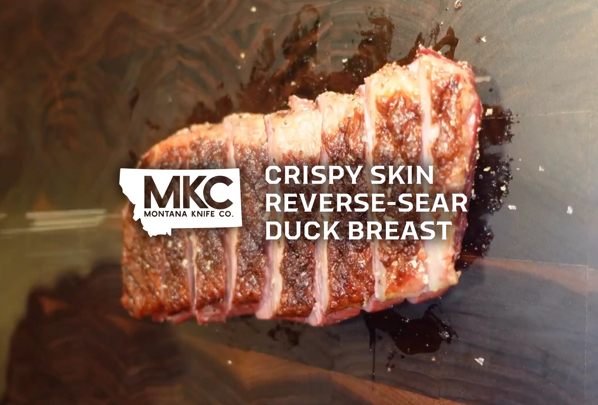 Sliced duck breast with golden-brown crispy skin.