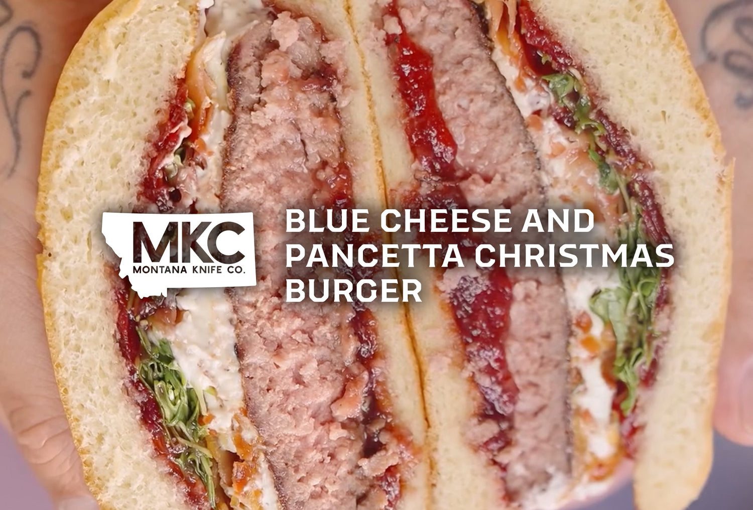 Christmas burger with beef patty, crispy pancetta, blue cheese dressing, cranberry sauce, and brioche bun.