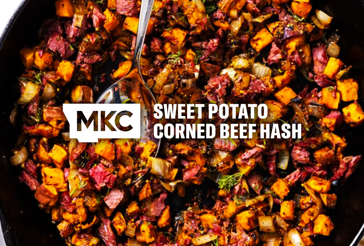 Sweet potato corned beef hash with diced sweet potatoes, chopped corned beef, onions, and herbs cooked in a skillet.