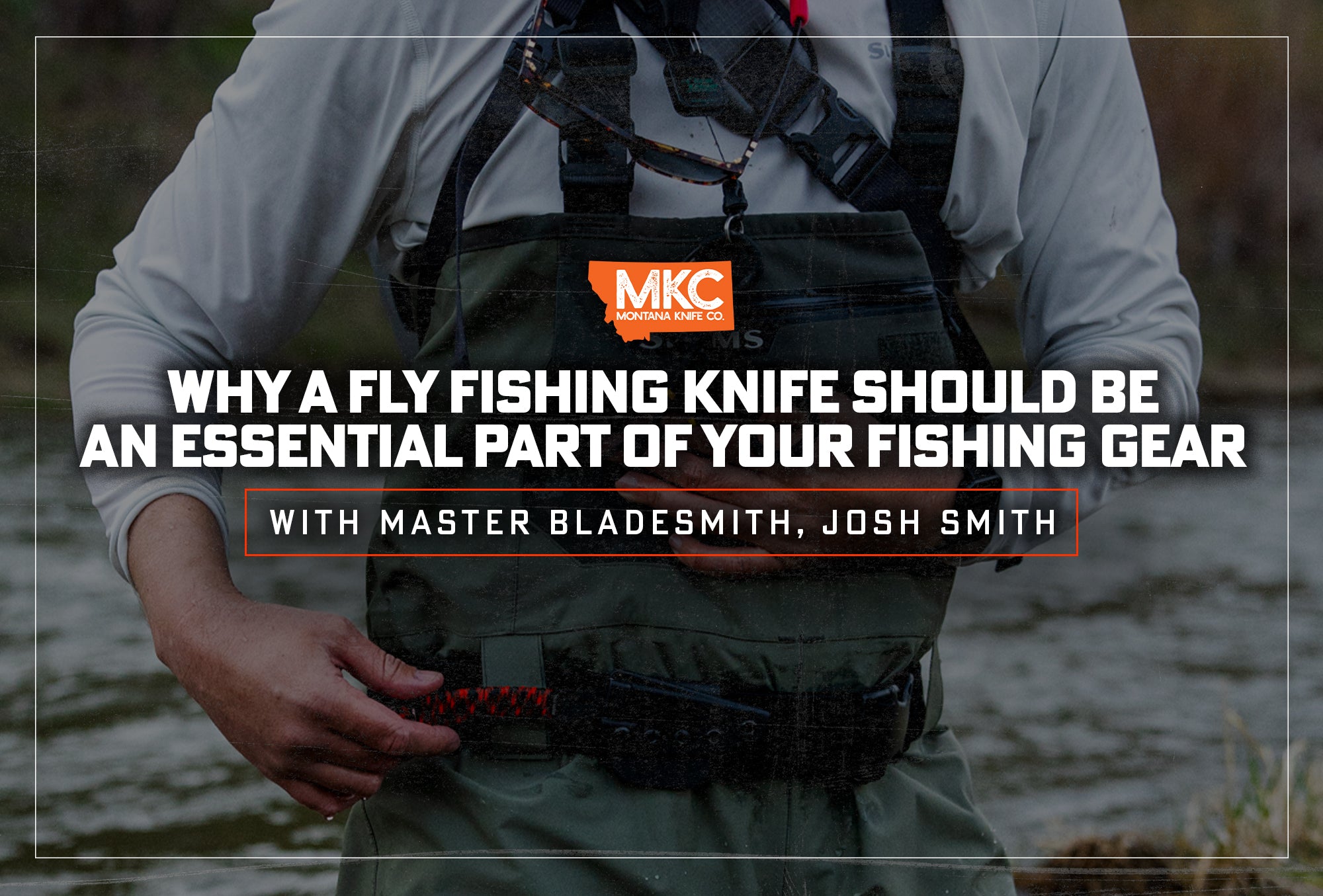 A fly fisherman exits a river with a fly fishing knife clipped to the front of his waders.