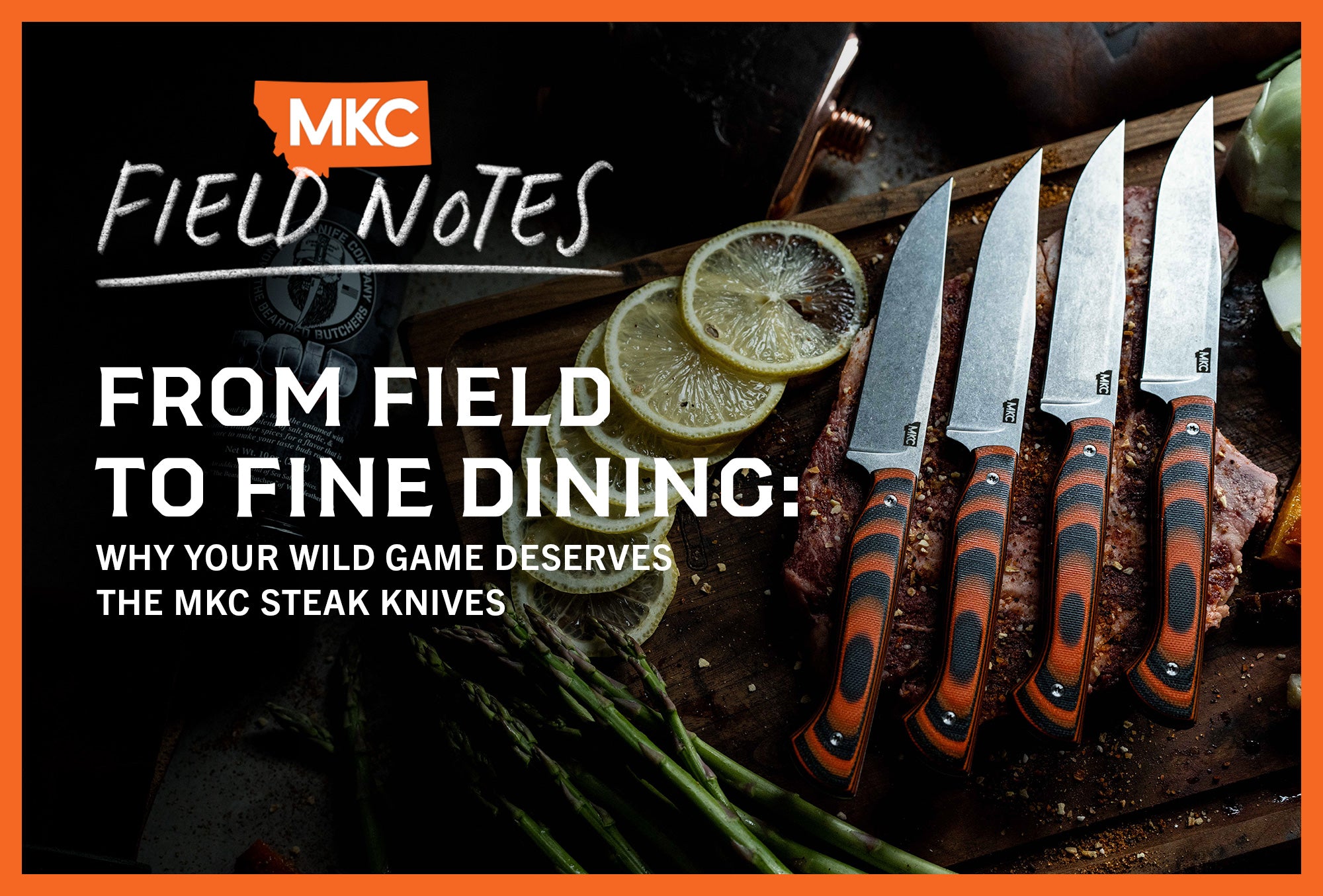 Four MKC steak knives lying on a wooden cutting board with lemon slices and asparagus.